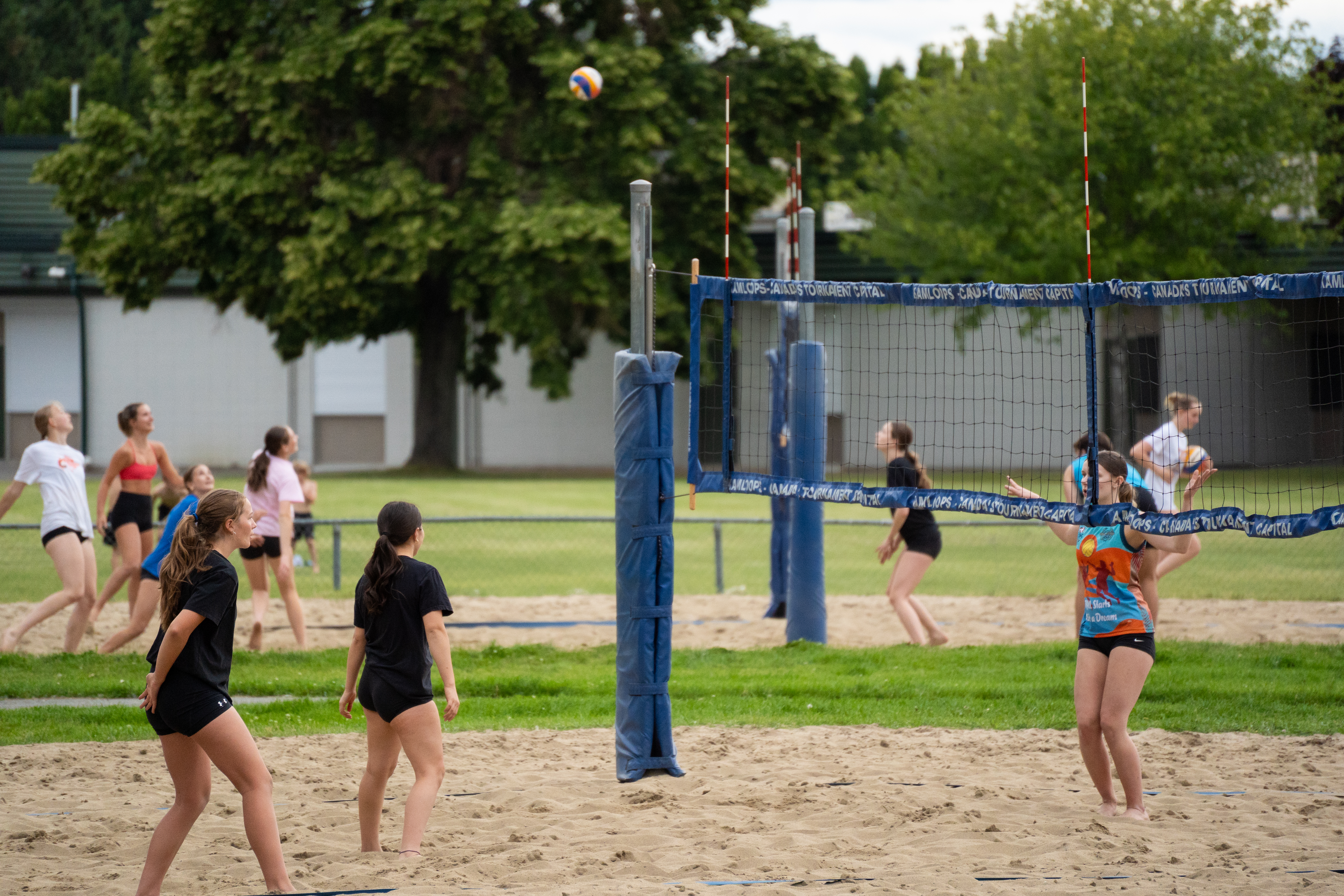 Athletes working on serve receive on the beach