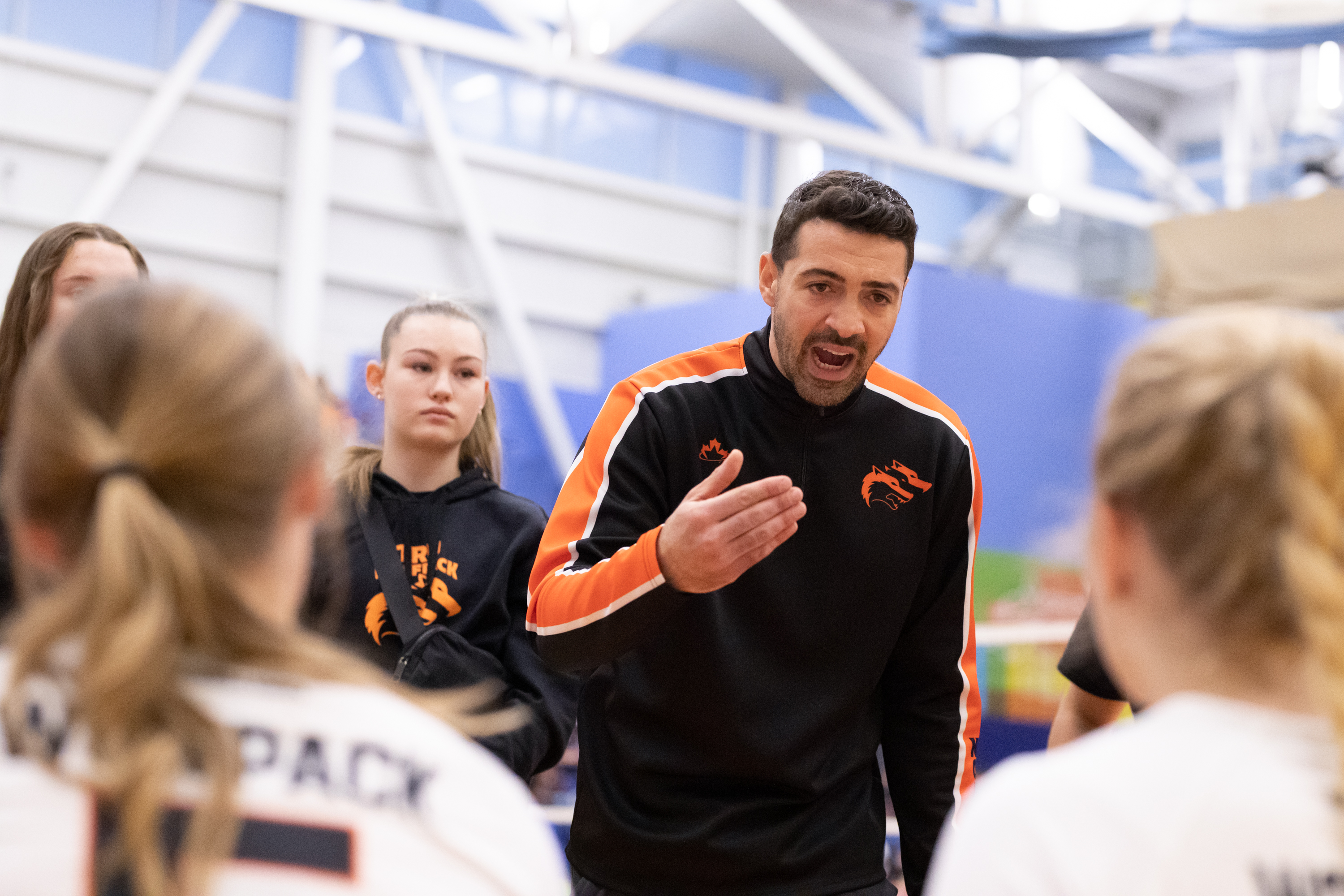 Coach Behlul coaching during training