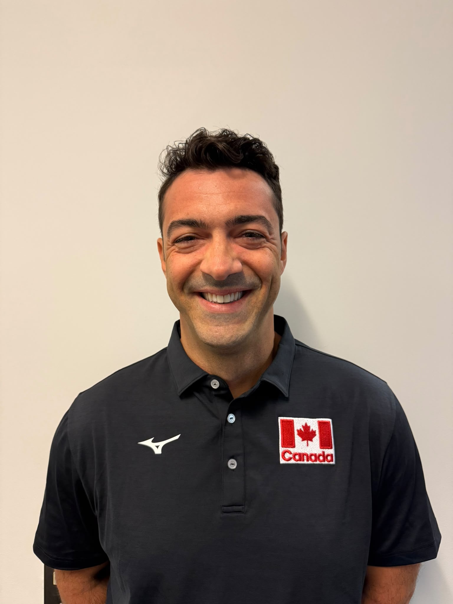 Coach Behlul Yavaşgel wearing Volleyball Canada coaching apparel